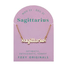 Zodiac Script Necklace in 14K Plated Gold featuring Sagittarius on a pink card, showcasing its celestial charm.