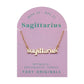 Zodiac Script Necklace in 14K Plated Gold featuring Sagittarius on a pink card, showcasing its celestial charm.